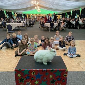 Children’s entertainer with Snowy the live rabbit at a birthday party in Ashby De La Zouch