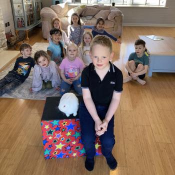 Children’s entertainer with Snowy the live rabbit at a birthday party in Southwell