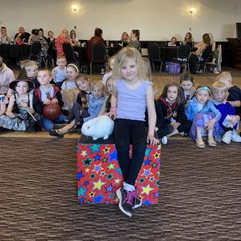 Children’s entertainer with Snowy the live rabbit at a birthday party in Stafford