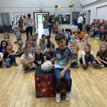 Children’s entertainer with Snowy the live rabbit at a birthday party in Sutton In Ashfield