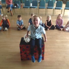 The birthday child in Leicester enjoys a wonderful moment with Snowy the rabbit and cheering friends.