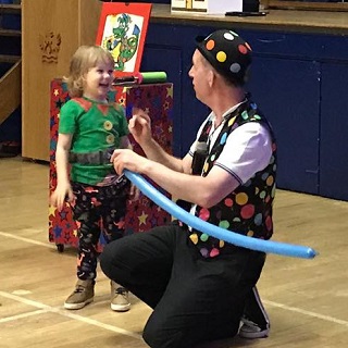Magic Stuart delighting children with an exciting magic performance at a birthday party