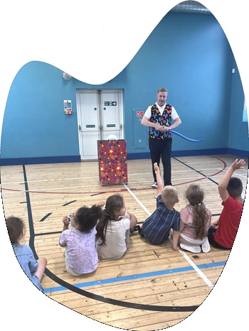 Magician performing a fun magic show for children’s birthday party in Derby with live rabbit Snowy.