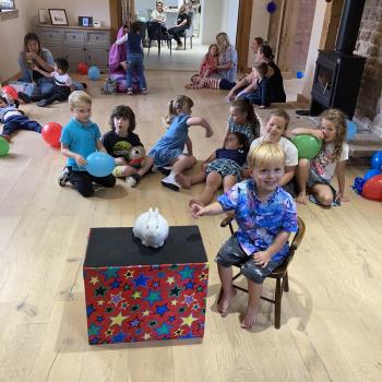 Happy Children’s Party Entertainment Findern A group of children laughing and clapping during a birthday party show in Findern