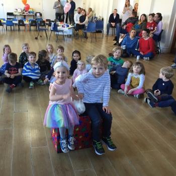 Happy Children’s Party Entertainment Hilton A group of children laughing and clapping during a birthday party show in Hilton
