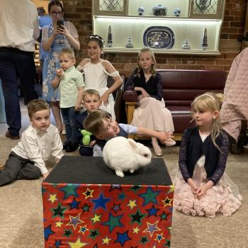 Children’s entertainer with Snowy the live rabbit at a wedding in Derby