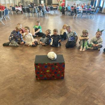Children’s entertainer with Snowy the live rabbit at a party in Kegworth