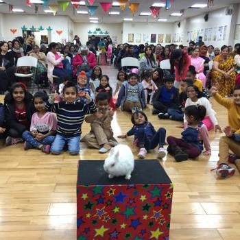 Children’s entertainer with Snowy the live rabbit at a party in Swadlincote