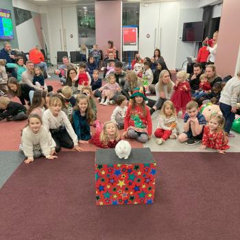 Children’s entertainer with Snowy the live rabbit at a christmas party event in Uttoxeter