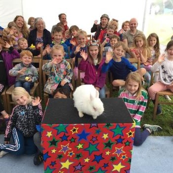 Children’s entertainer with Snowy the live rabbit at an event in West Bridgford