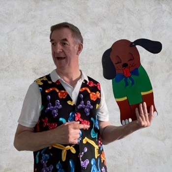 children's party magician entertainer for Birthdays Magic Stuart performing a fun and interactive magic show for children at a birthday party