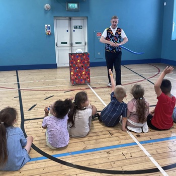Children's entertainer performing an interactive comedy magic show at a birthday party in Alfreton