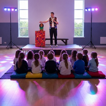 Children's entertainer performing an interactive fun magic show at a birthday party in Beeston