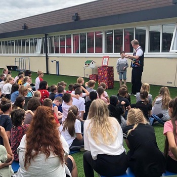 Children's entertainer performing an interactive fun magic show at a school in Belper