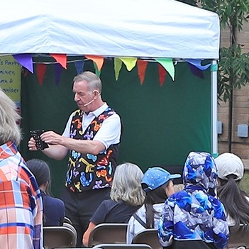 Children's entertainer performing an interactive fun magic show at a birthday party in Findern