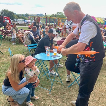 Children's entertainer performing an interactive fun magic show at a fun day in Kegworth