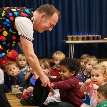 Children's entertainer performing an interactive fun magic show at a birthday party in Kirkby In Ashfield