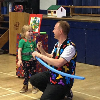 Children's entertainer performing an interactive fun magic show at a birthday party in Mansfield