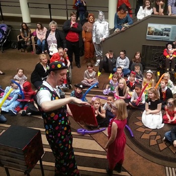 Children's entertainer performing an interactive fun magic show at a charity event in Matlock