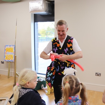 Children's entertainer performing an interactive fun magic show at a birthday party in Newark