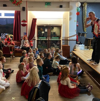 Children's entertainer performing an interactive fun magic show at a birthday party in Sheffield