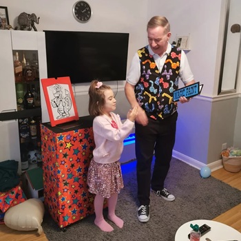 Children's entertainer performing an interactive fun magic show at a birthday party in Southwell
