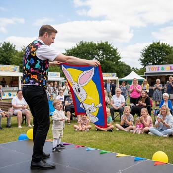 Children's entertainer performing an interactive fun magic show at a fun day in Stoke On Trent