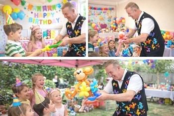 A young child receiving a balloon creation from Magic Stuart at an outdoor birthday party