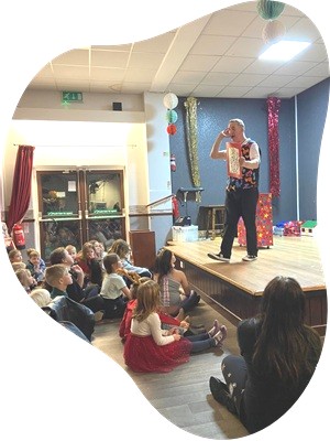 Magic Stuart presenting a live magic show with Snowy the rabbit at a childrens party in Derby