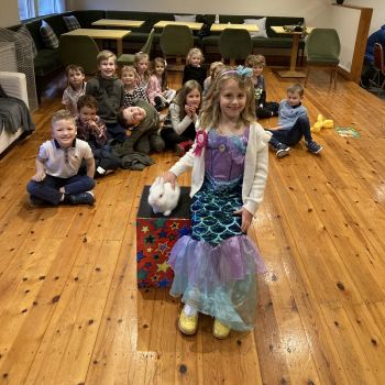 Derby children enjoying a birthday magic show featuring Snowy the rabbit