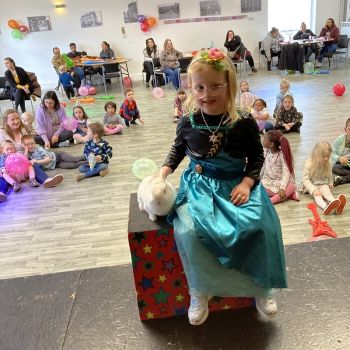 See the joy on children's faces as they pose with Snowy the rabbit at a birthday party in Mansfield.