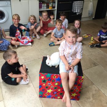 Group photo with birthday child and Snowy at a Derby party